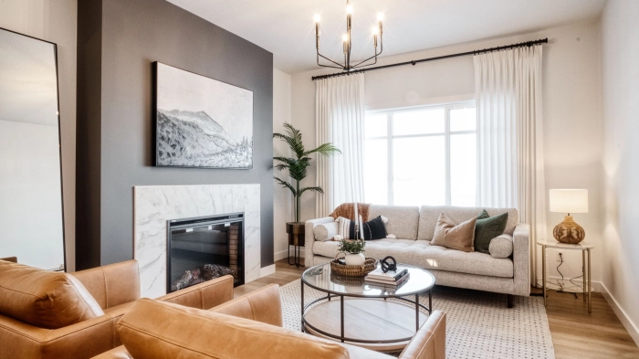 Depicts a clean, modern living room featuring a fireplace.