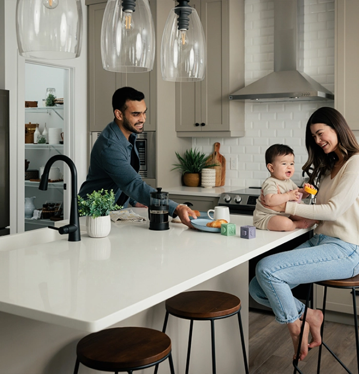A happy family gathered in a cozy kitchen, enjoying time together.